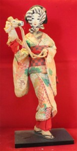 This sakura doll represents a ritual dance ("Spring Horse").