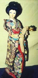 The lady doll here is a young girl handling a lion puppet in a Kabuki play.